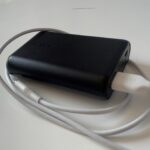 An Anker PowerCore 10000mAh power bank with a USB cable attached