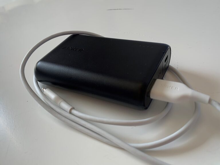 An Anker PowerCore 10000mAh power bank with a USB cable attached