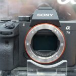 Front view of a Sony a7 III camera body with no lens attached